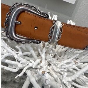 Brighton women's tan leather western belt with an ornate silver-toned buckle MD